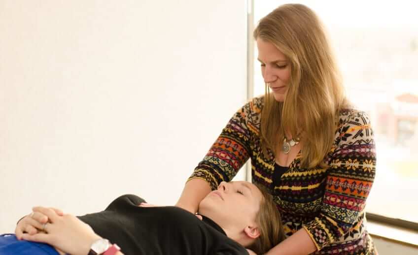 physical therapist using manual therapy, Treating a patient with neck pain