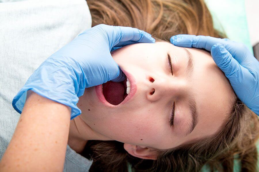 TMJ palpation intraoral performed by physical therapist